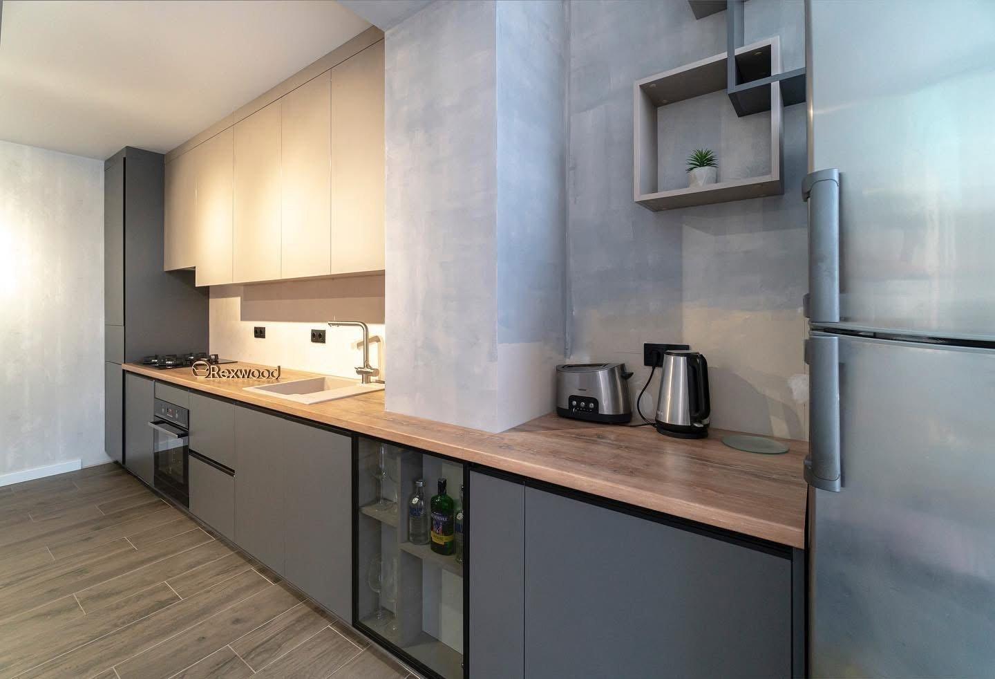 Graphite & Greige Single-Wall Kitchen with Glass-Fronted Bar Cabinet — 3