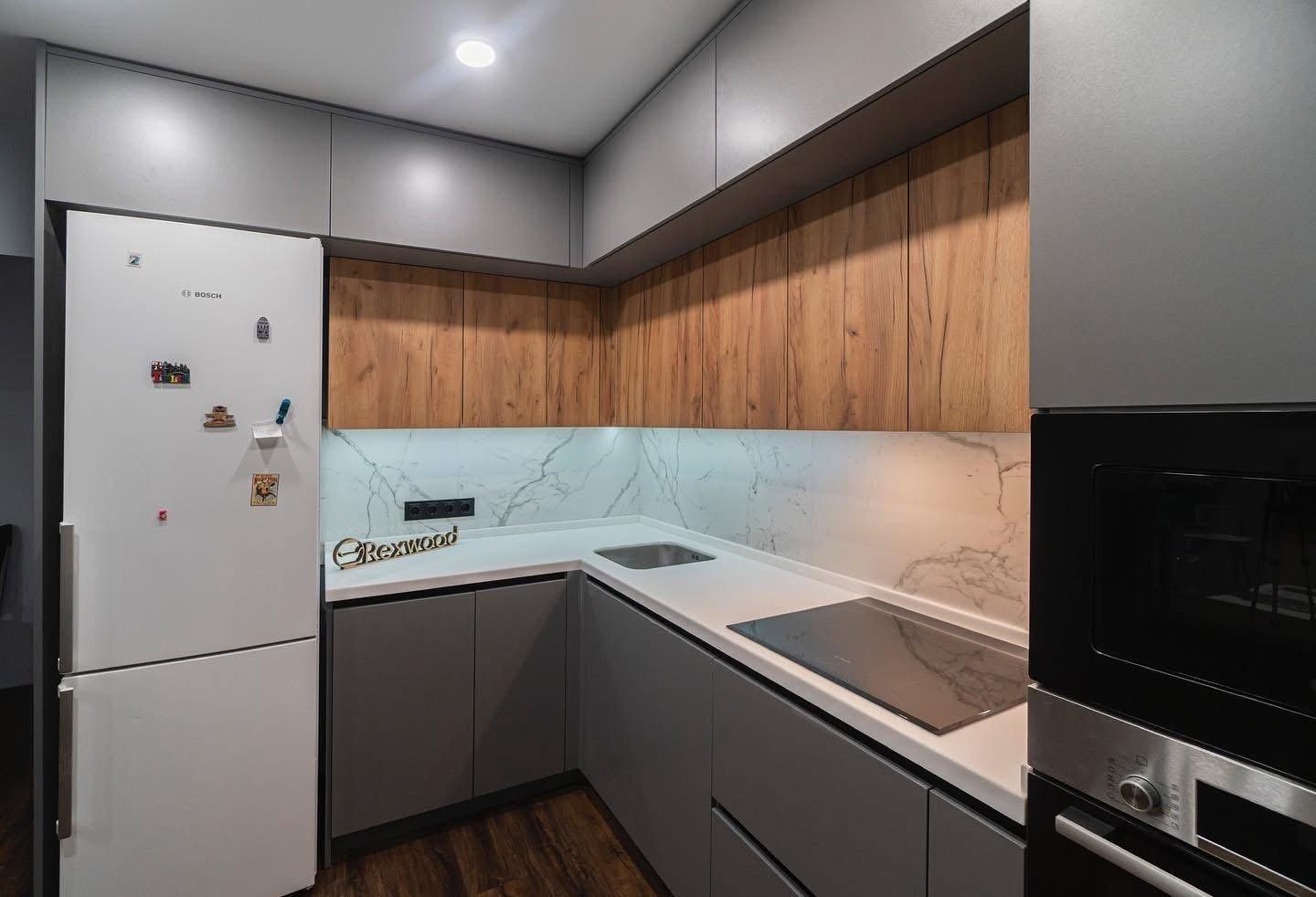 Grey & Oak Handleless L-Shaped Kitchen with White Solid-Surface Worktop — 3