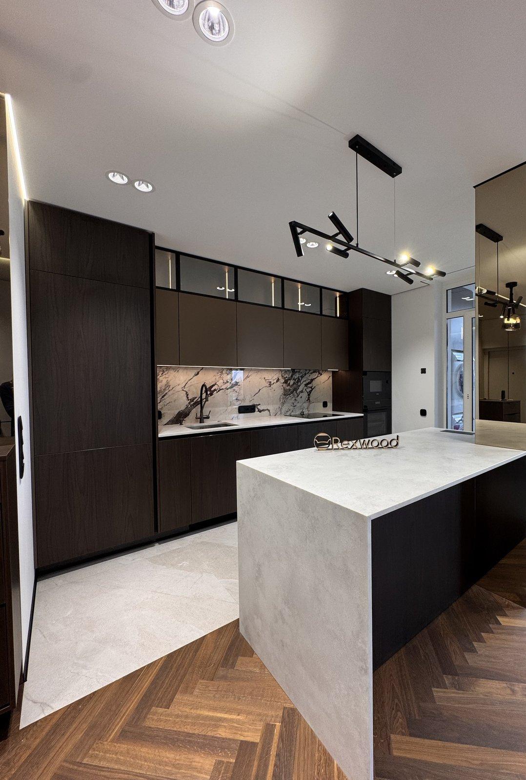 Custom-built kitchen in dark walnut-toned panels