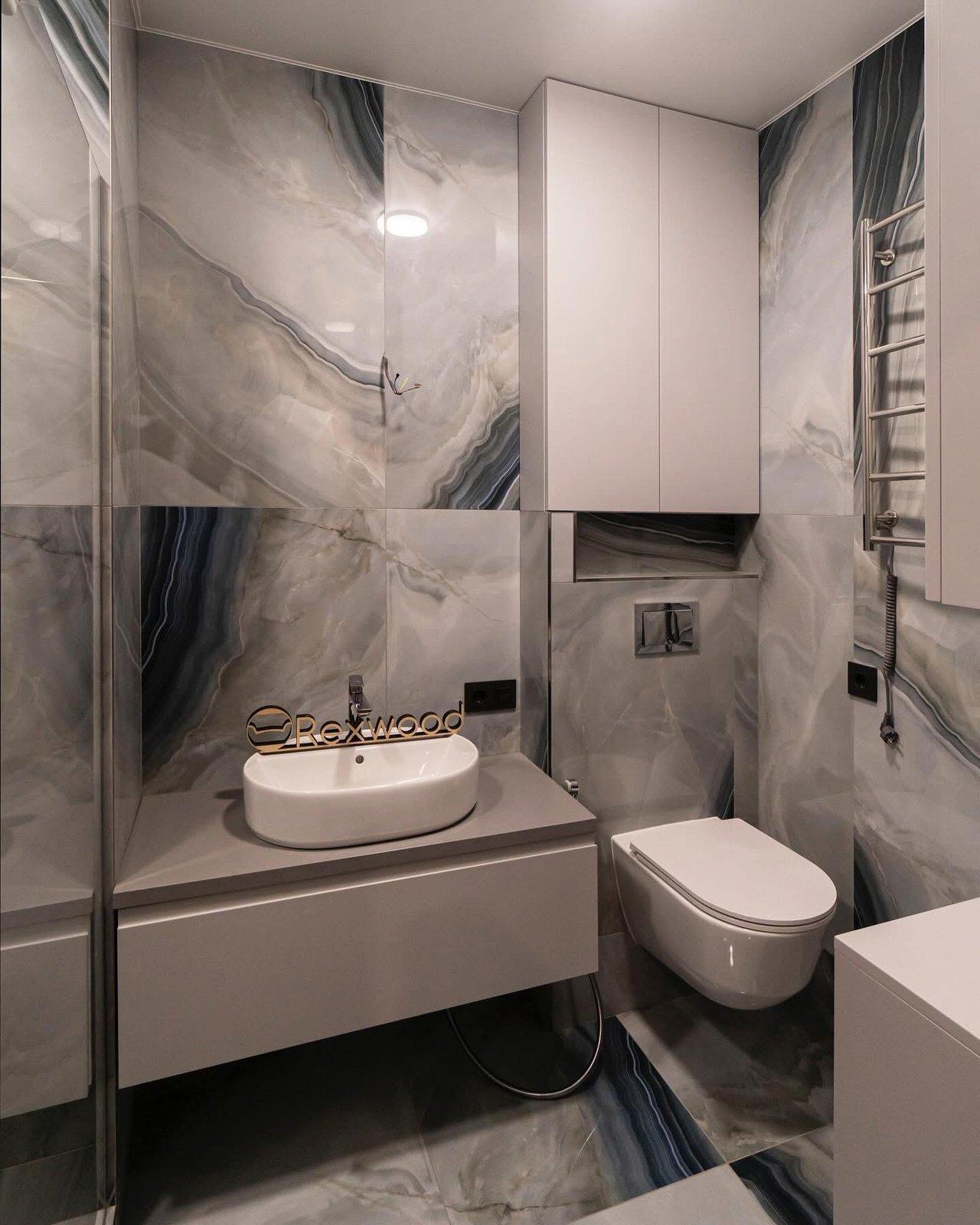 Compact Bathroom with Concealed Water Heater & Storage