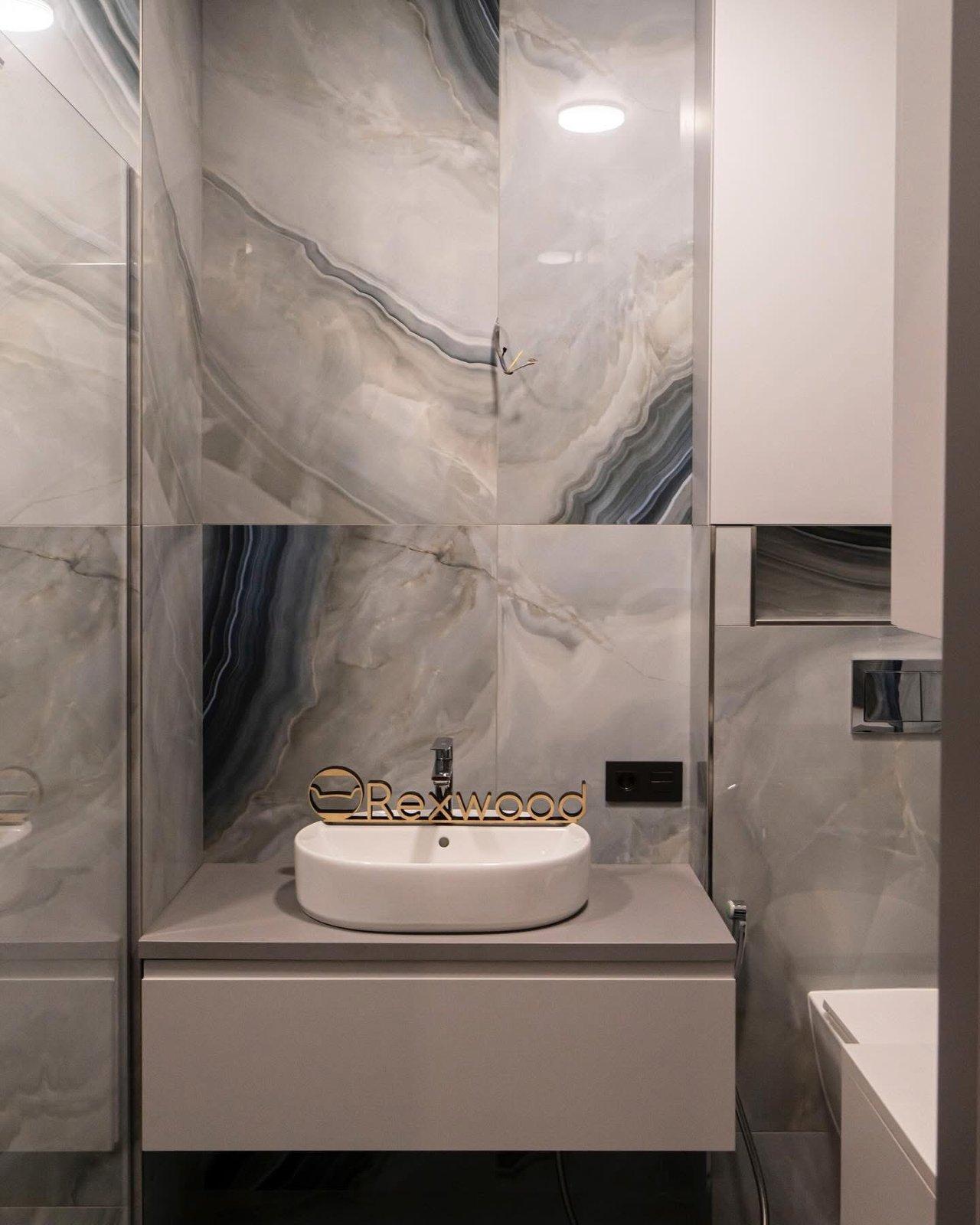 Compact Bathroom with Concealed Water Heater & Storage — 2