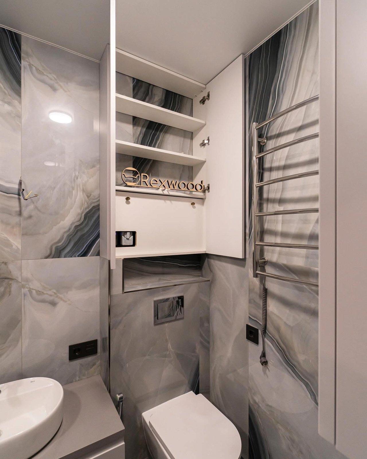 Compact Bathroom with Concealed Water Heater & Storage — 4