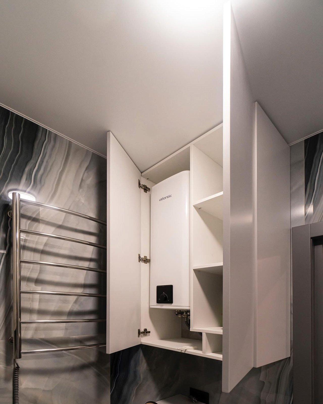 Compact Bathroom with Concealed Water Heater & Storage — 5