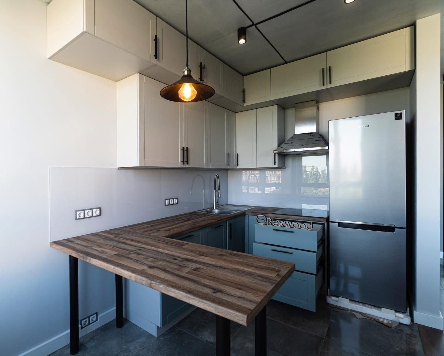 Blue and Cream Shaker U-Shaped Kitchen with Wood Bar