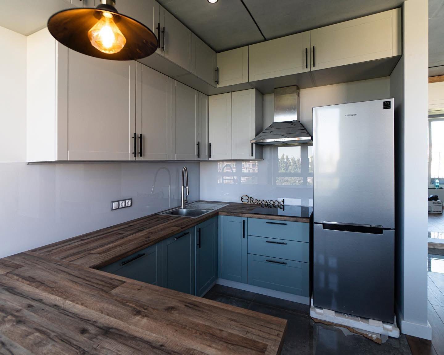 Blue and Cream Shaker U-Shaped Kitchen with Wood Bar — 3