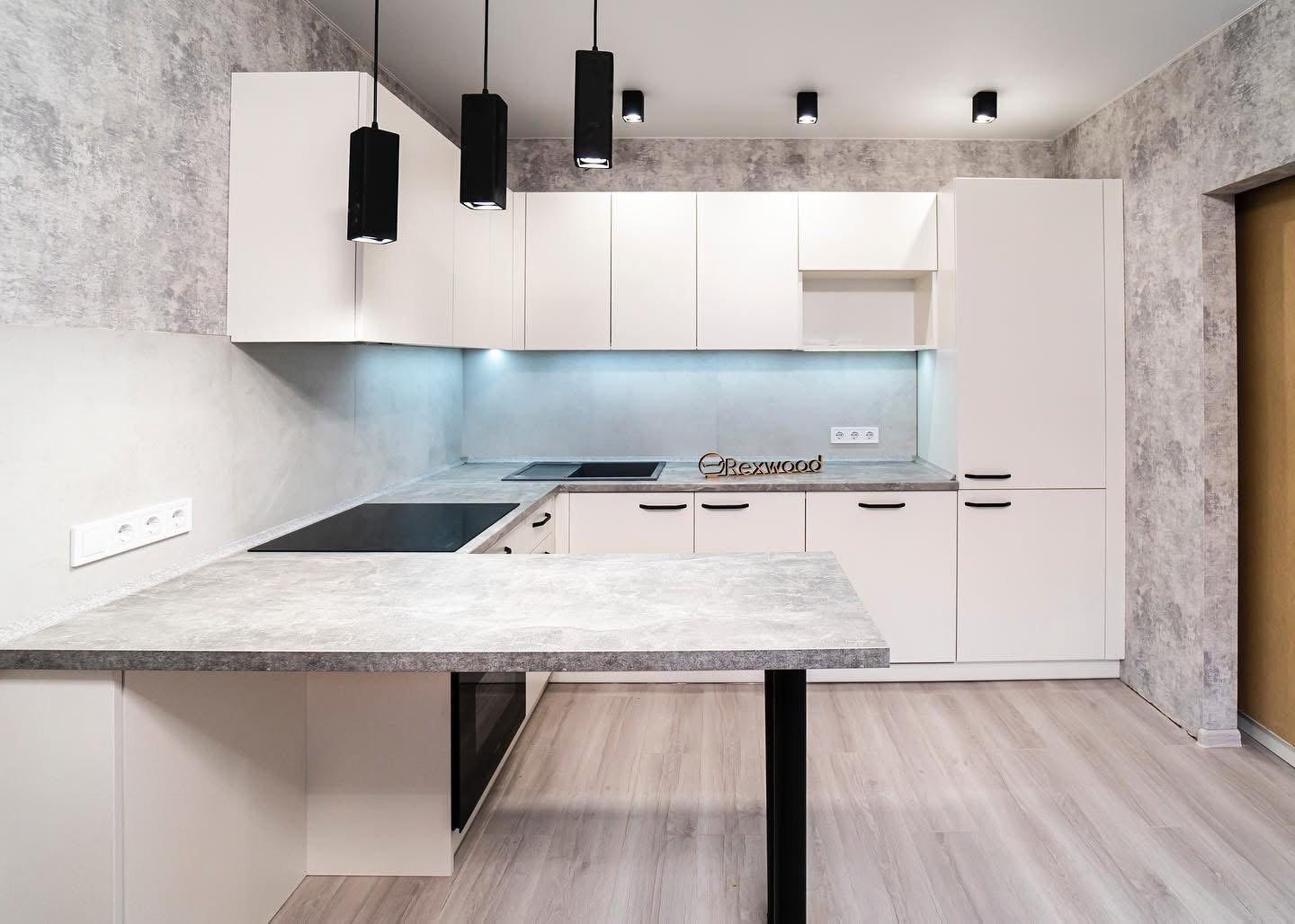 Cream U-Shaped Kitchen with Concrete-Effect Breakfast Bar