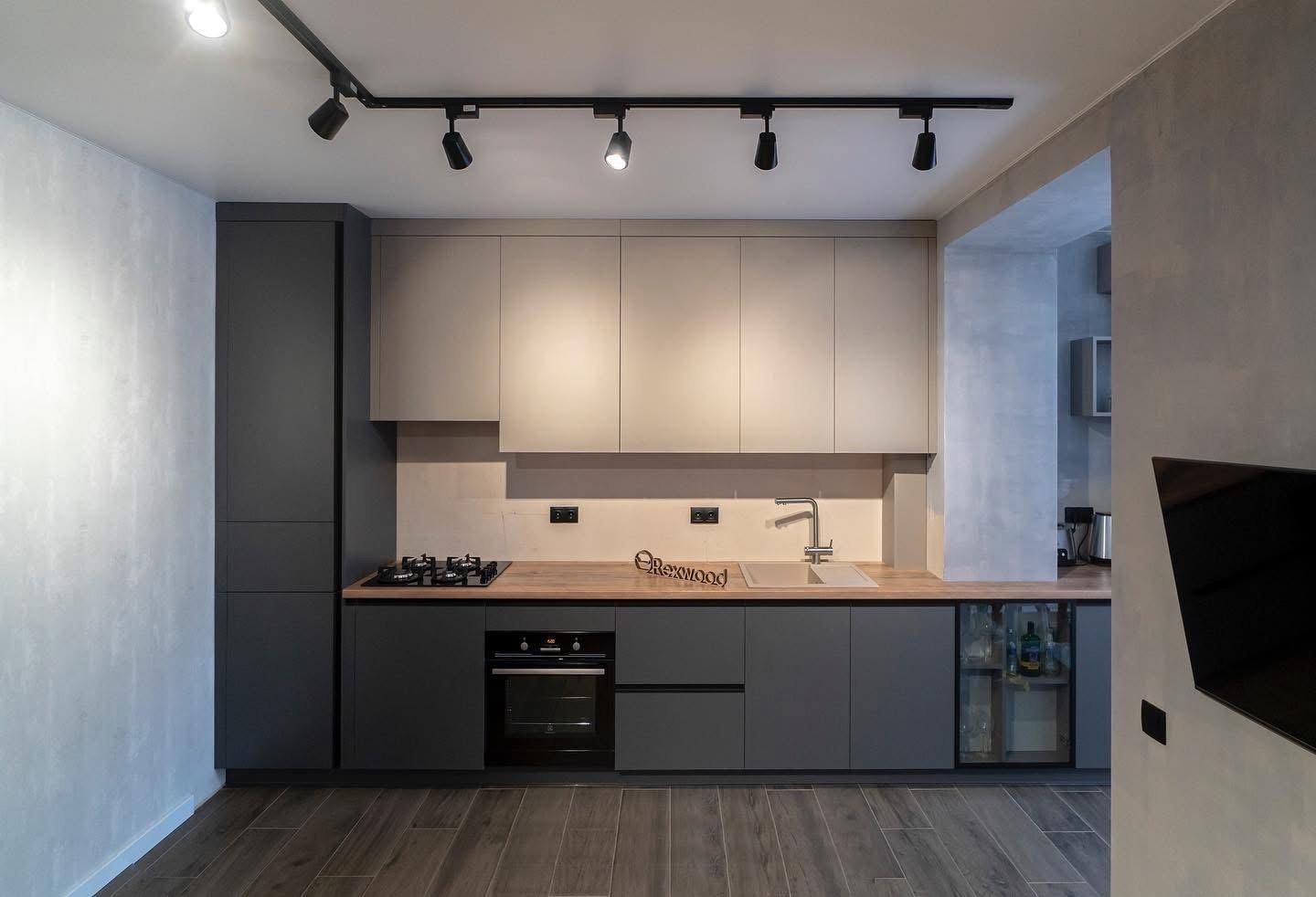 Graphite & Greige Single-Wall Kitchen with Glass-Fronted Bar Cabinet