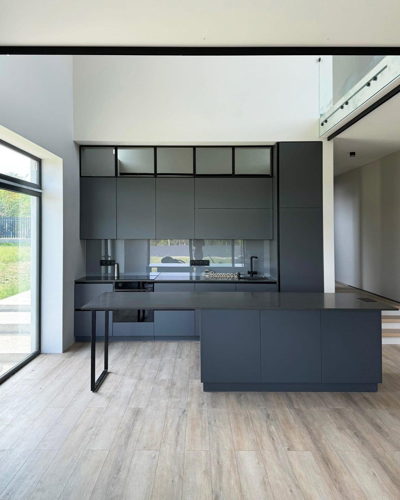 Graphite Kitchen in a Double-Height Space — 2