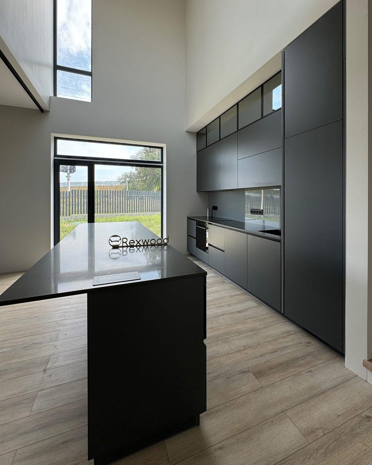 Graphite Kitchen in a Double-Height Space — 3