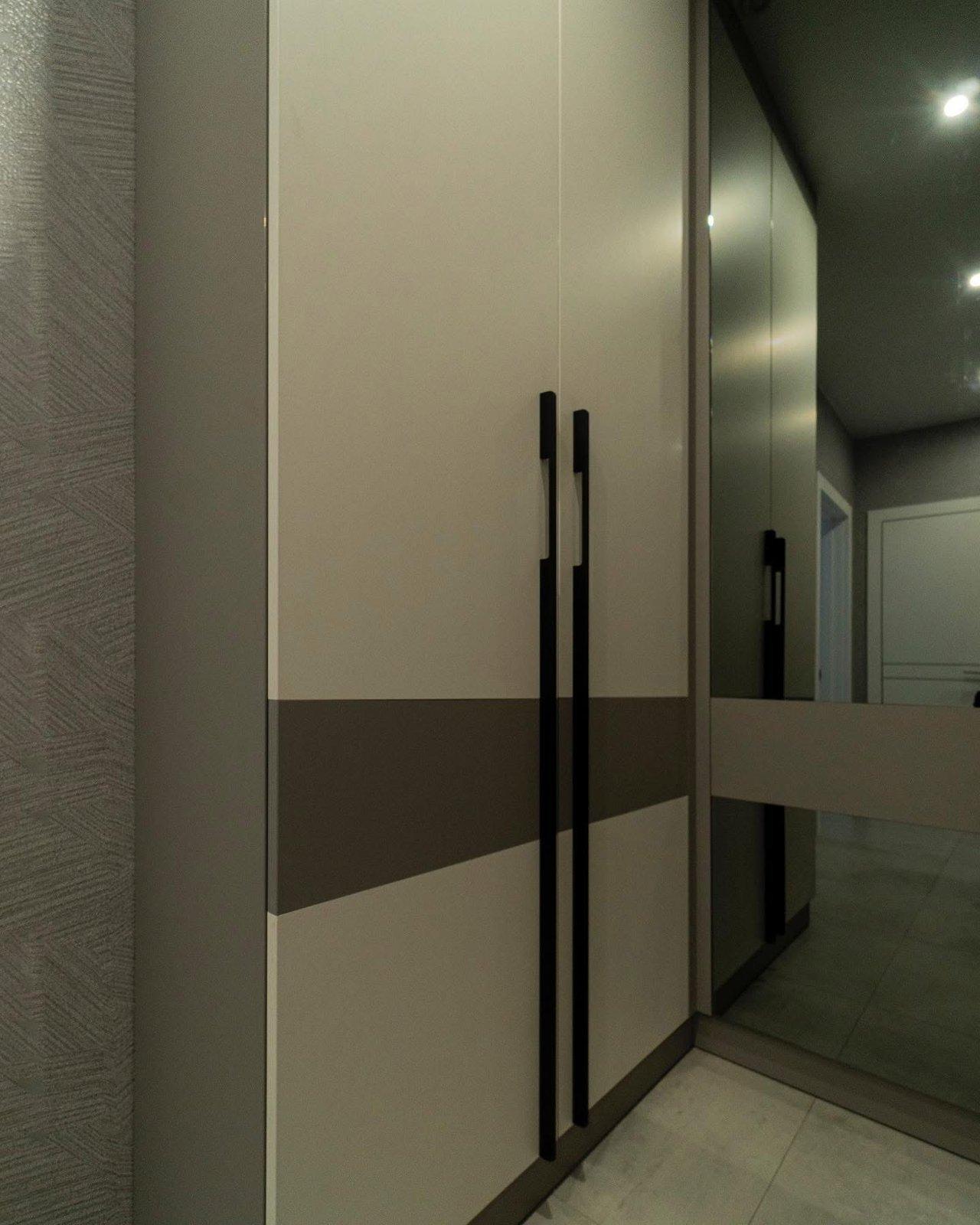 Greige Entryway with Smoked Mirror Wardrobe & Floating Console — 3