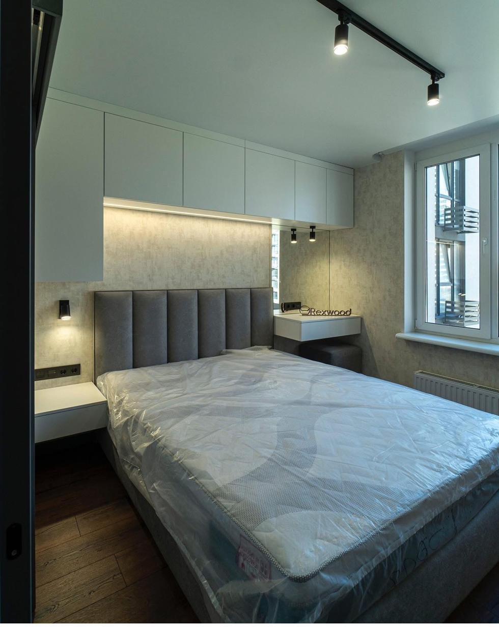 Bedroom with Storage Headboard