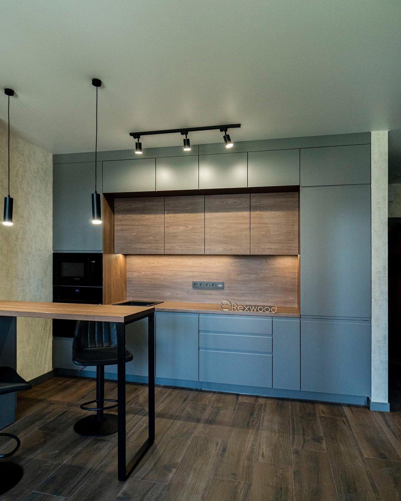 Grey Kitchen with Wood Niche & Bar Table