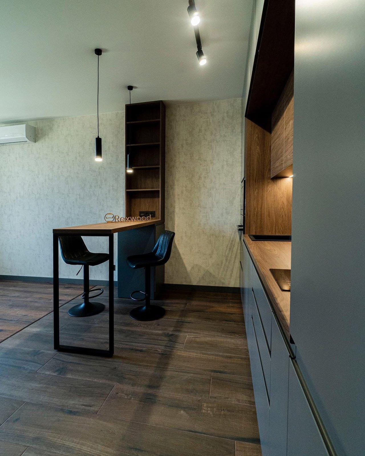 Grey Kitchen with Wood Niche & Bar Table — 4