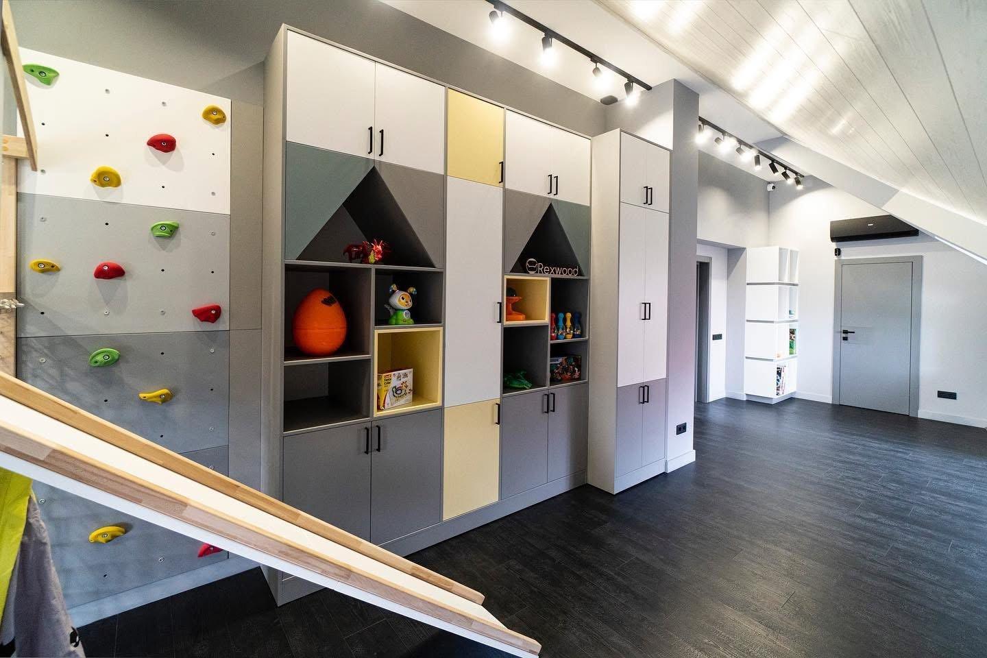 Attic Playroom with House-Shaped Shelving