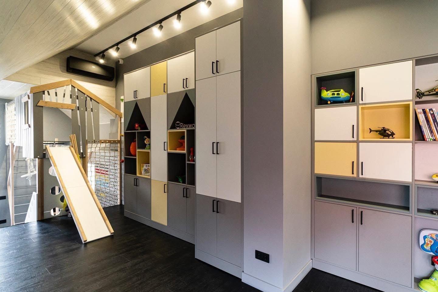 Attic Playroom with House-Shaped Shelving — 3