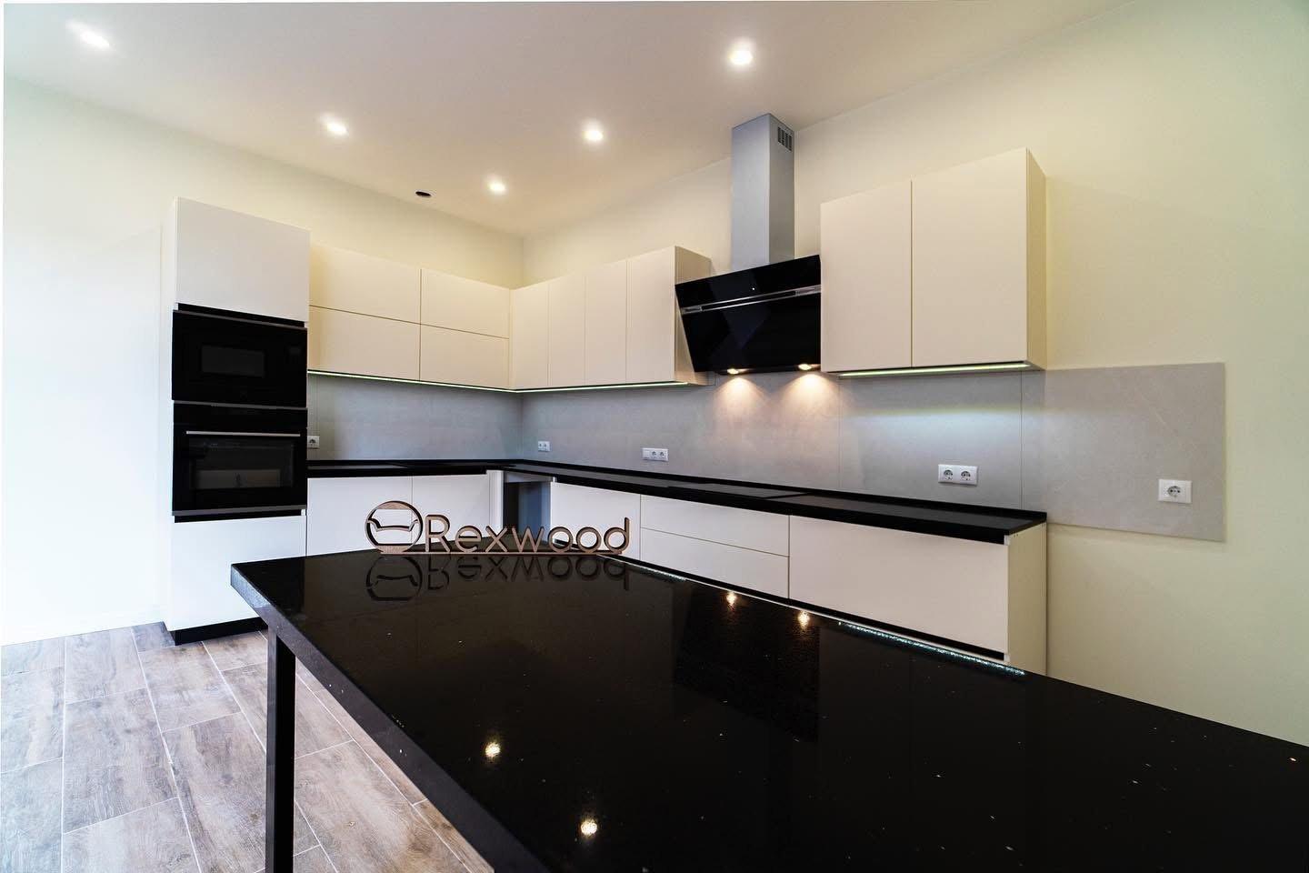 Ivory Handleless L-Shaped Kitchen with Black Worktop & Bar Table — 3