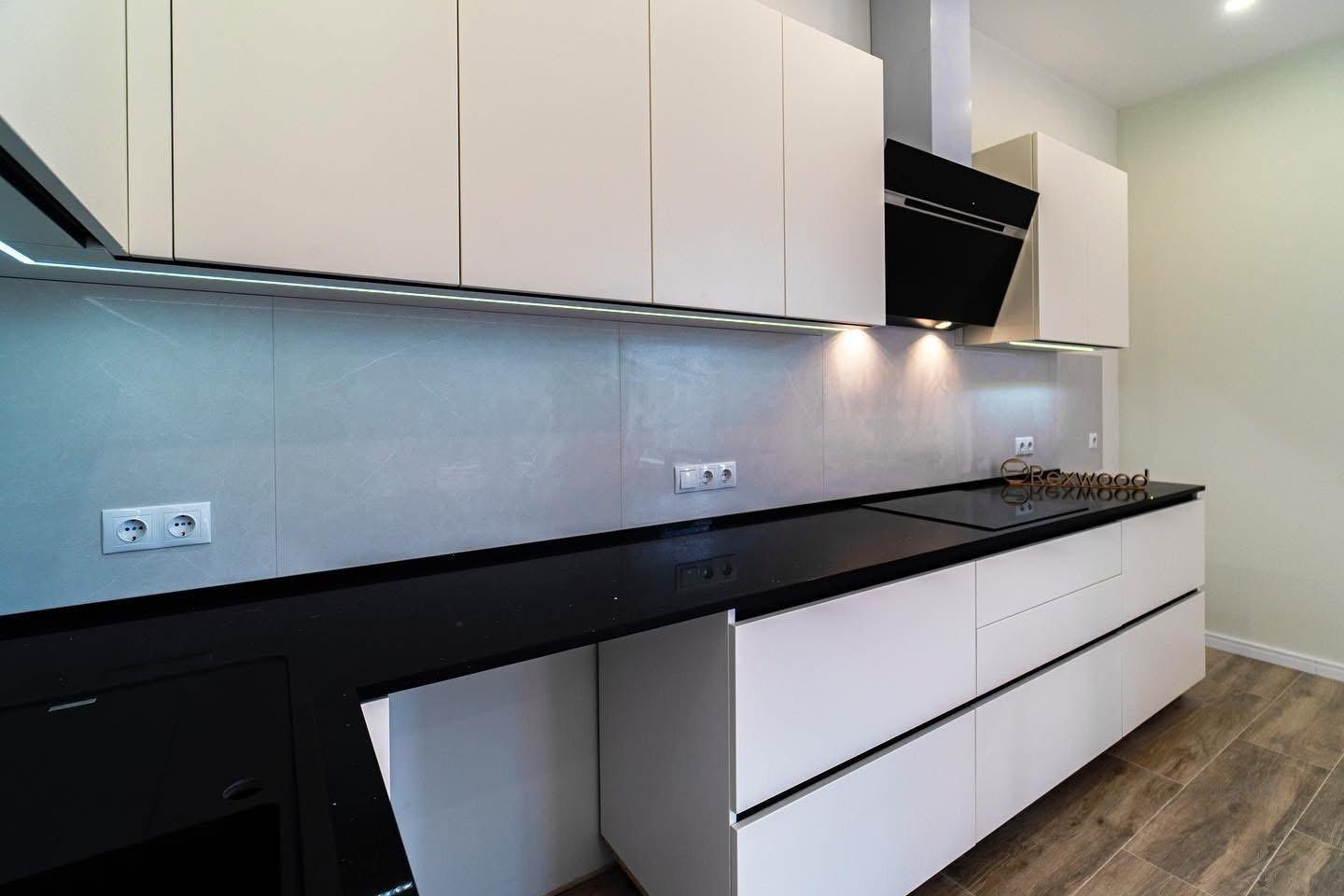 Ivory Handleless L-Shaped Kitchen with Black Worktop & Bar Table — 4
