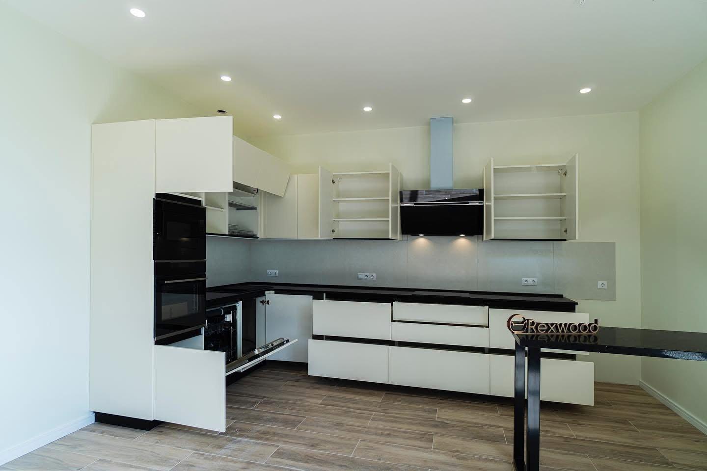 Ivory Handleless L-Shaped Kitchen with Black Worktop & Bar Table — 7