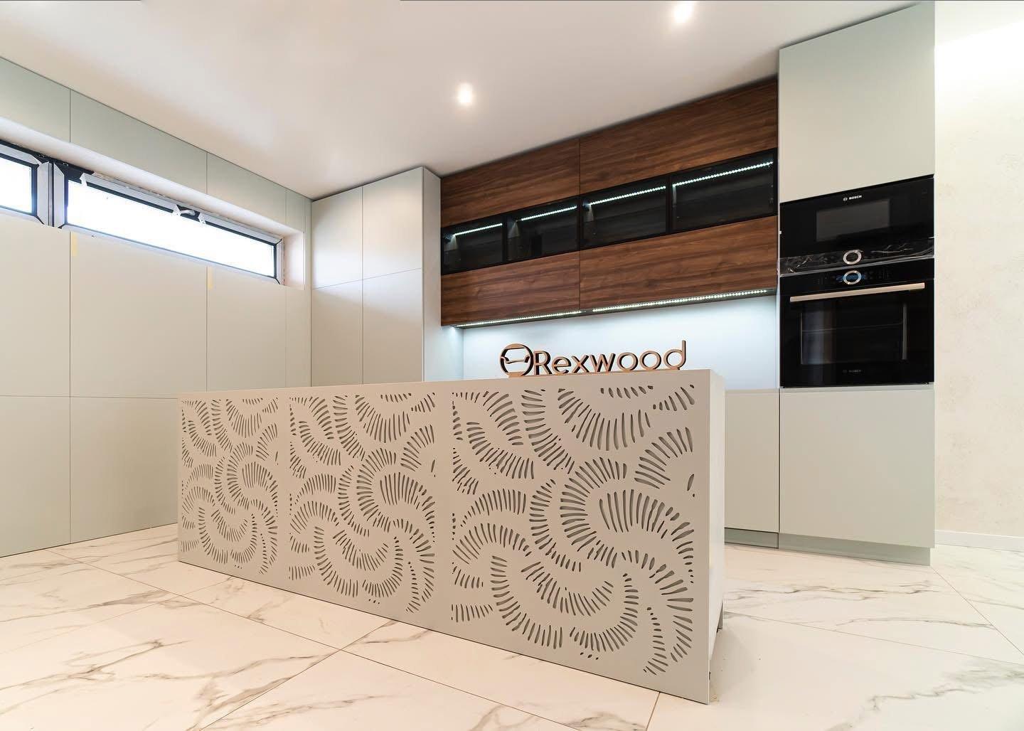 Sage & Walnut Kitchen with Perforated Island Panel