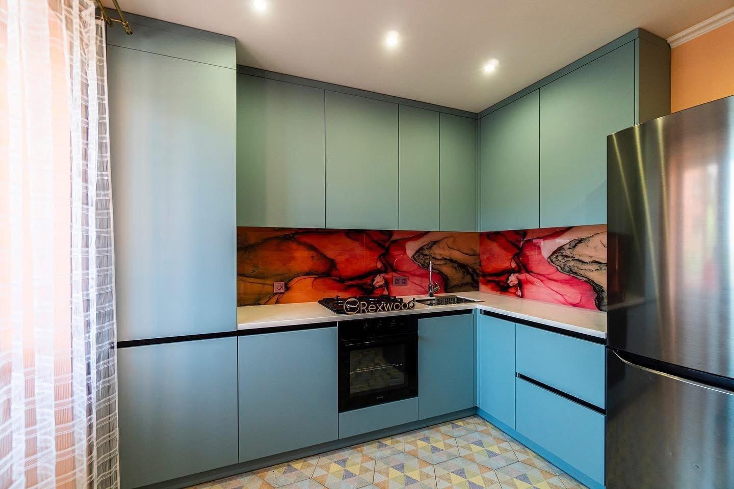 Teal Handleless L-Shaped Kitchen with Art Glass Splashback