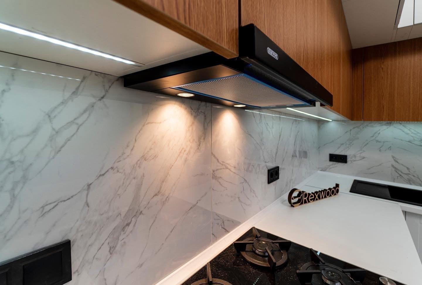 White Shaker & Oak L-Shaped Kitchen with Black-Framed Glass Column — 4