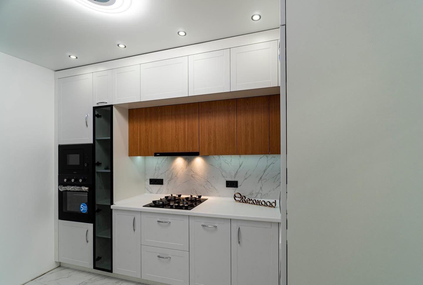 White Shaker & Oak L-Shaped Kitchen with Black-Framed Glass Column — 5